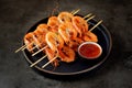 Large grilled prawns on wooden skewers. Shrimp kebabs.