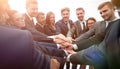 large group of business people standing with folded hands togeth Royalty Free Stock Photo