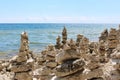 A large group of cairns built along the rocky shoreline of Lake Michigan in Cave Point County Park, Door County, Wisconsin Royalty Free Stock Photo