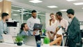 A large group of co-workers and managers are having a friendly meeting in a large modern office Royalty Free Stock Photo