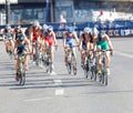 Large group of colorful triathletes cycling