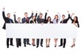 Large group of excited businesspeople presenting banner Royalty Free Stock Photo