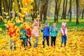 A large group of friends play in a beautiful autumn park Royalty Free Stock Photo