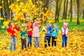 Large group of friends play in a beautiful autumn park Royalty Free Stock Photo