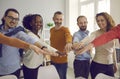 Large group of happy diverse people spreading hands joining palms together Royalty Free Stock Photo