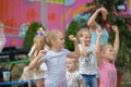 A large group of happy fun sports kids jumping, sports and dancing. Childhood, freedom, happiness, the concept of an active Royalty Free Stock Photo