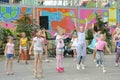 A large group of happy fun sports kids jumping, sports and dancing. Childhood, freedom, happiness, the concept of an active