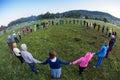 Large group of happy peoples play roundelay Royalty Free Stock Photo