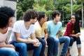 Large group of international young adults in discussion Royalty Free Stock Photo