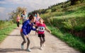 Large group of multi generation people running a race competition in nature. Royalty Free Stock Photo