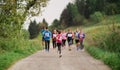 Large group of multi generation people running a race competition in nature. Royalty Free Stock Photo