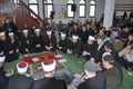 A large group of Muslim imams say a prayer to the exalted god Royalty Free Stock Photo