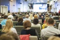 Large Group of People on a Conference. Watching Business Presentation on a Big Screen in Front Royalty Free Stock Photo