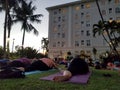 Large group of People do Pidgin yoga pose at Vino and Vinyasa event