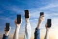 a large group of people hold digital phones device, many human hands