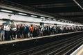 Large group of people on a platform of Moorgate station, London Undeground, UK Royalty Free Stock Photo