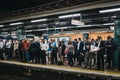 Large group of people on a platform of Moorgate station, London Undeground, UK Royalty Free Stock Photo