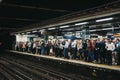 Large group of people on a platform of Moorgate station, London Undeground, UK Royalty Free Stock Photo