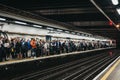 Large group of people on a platform of Moorgate station, London Undeground, UK Royalty Free Stock Photo