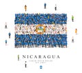 A large group of people are standing in blue, white and yellow robes, symbolizing the flag of Nicaragua