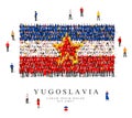 A large group of people are standing in blue, yellow, white and red robes, symbolizing the flag of Yugoslavia