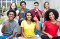 Large group of pretty international young adults showing thumb u Royalty Free Stock Photo