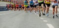 large group runners leading marathon