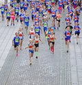 Large group of running girls and boys in blue