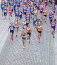 Large group of running girls and boys in blue