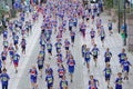 Large group of running girls and boys in blue Royalty Free Stock Photo