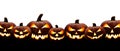 A large group of seven spooky halloween lanterns, Jack O Lantern, with evil face and eyes