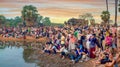 A large group of spectators waiting for the sun to rise at Angkor Wat in Cambodia. Royalty Free Stock Photo