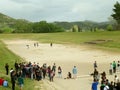 Large group of students enjoy visiting the old stadium of Ancient Olympia, UNESCO world heritage site in Greece