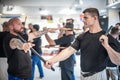 Large group of students practice filipino eskrima stick fight techniques Royalty Free Stock Photo