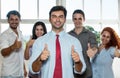 Large group of successful businesspeople showing thumbs up