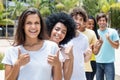 Large group of successful multi ethnic young adults in line Royalty Free Stock Photo