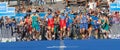 Large group of triathletes running in the transition zone Royalty Free Stock Photo