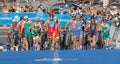 Large group of triathletes running in the transition zone Royalty Free Stock Photo