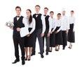 Large group of waiters and waitresses standing in row Royalty Free Stock Photo