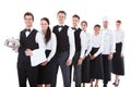 Large group of waiters and waitresses standing in row Royalty Free Stock Photo