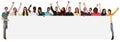 Large group of young multi ethnic people holding empty banner wi Royalty Free Stock Photo