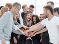 large group of young people joining their hands together. Royalty Free Stock Photo