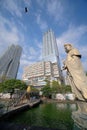 Large Guanyin statue, Seema Malakaya temple over Beira Lake, in juxtaposition with skyscrapers of Colombo City Mall & Altair Condo