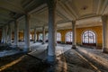 Large hall with columns in old abandoned mansion