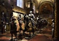 Large hall, with many mannequins of harnessed horses and knights with ancient medieval armor, in the historic Stibbert villa in Fl