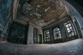 A large hall in an old abandoned house.
