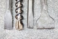 Large hammer drill bit and chisel set. Tools for concrete and hard surfaces. Close-up Royalty Free Stock Photo