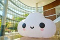 Large happy cloud installation inside interior space