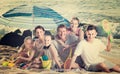 Large happy family on beach sitting on weekend Royalty Free Stock Photo