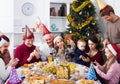 Large family making numerous photos during Christmas dinner Royalty Free Stock Photo